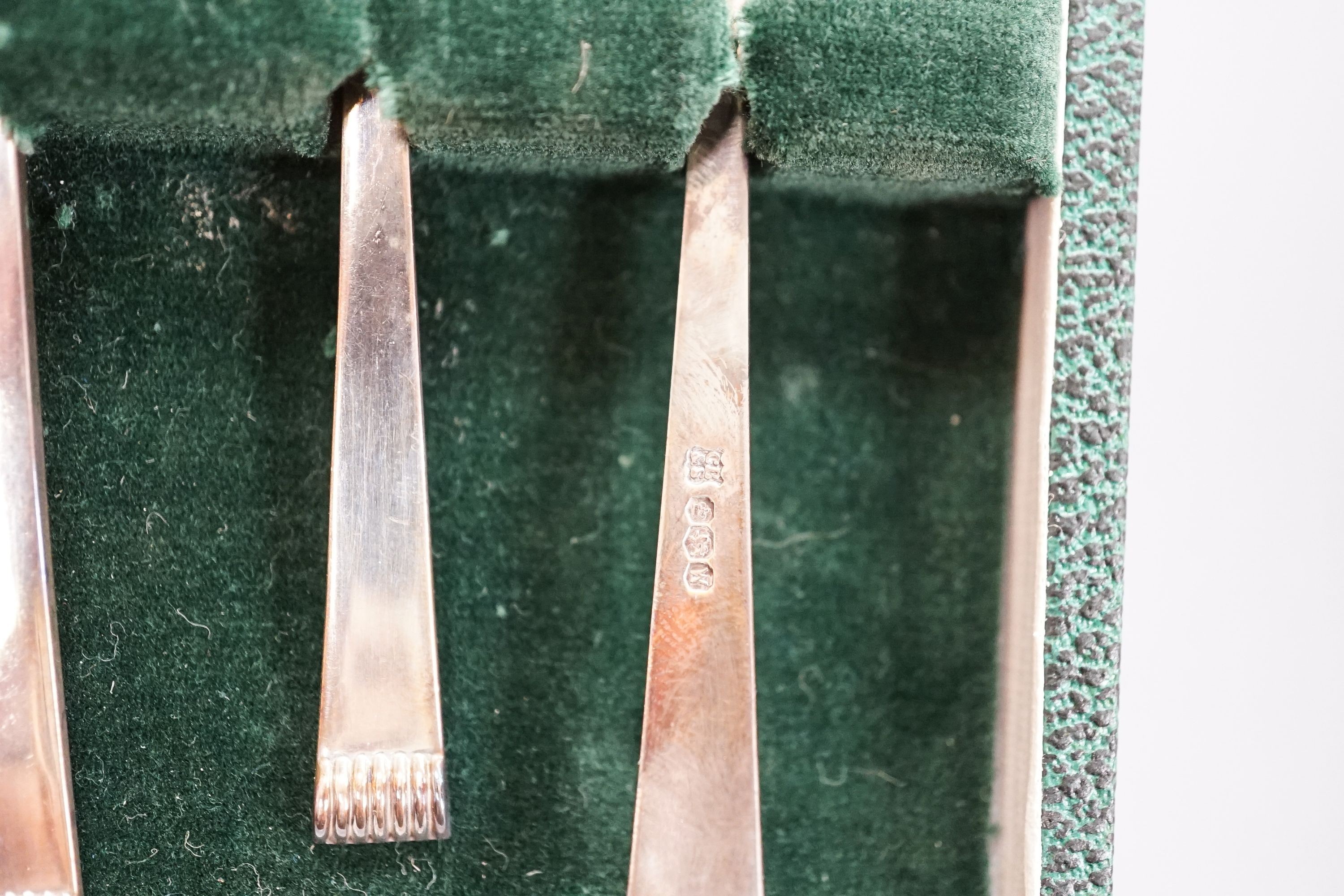 Seven assorted cased sets of English silver tea and coffee spoons, including a set of twelve silver gilt teaspoons, London, 1882 (one set incomplete).